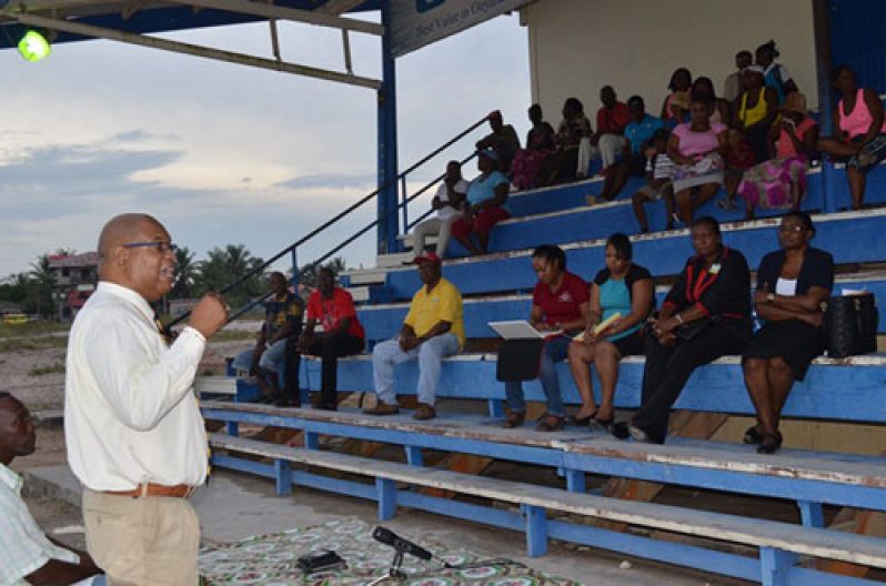 Minister in the Ministry of Finance, Juan Edghill addressing residents of Block 22 Wismar and other surrounding communities