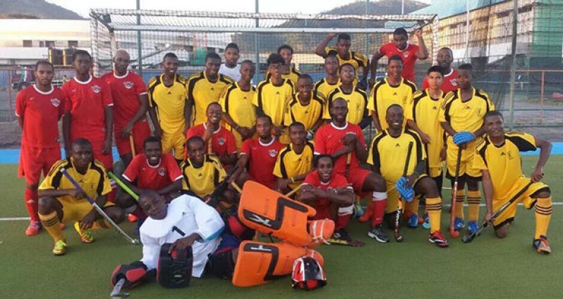 Guyana National Junior squad (in gold) and Paragon players pose after their friendly match.