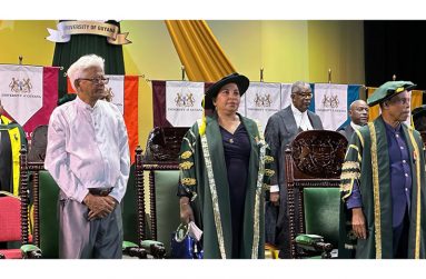 Kanhai Singh (left) with University of Guyana Vice-Chancellor, Dr Paloma Mohamed and Chancellor, Professor John Edward Greene.