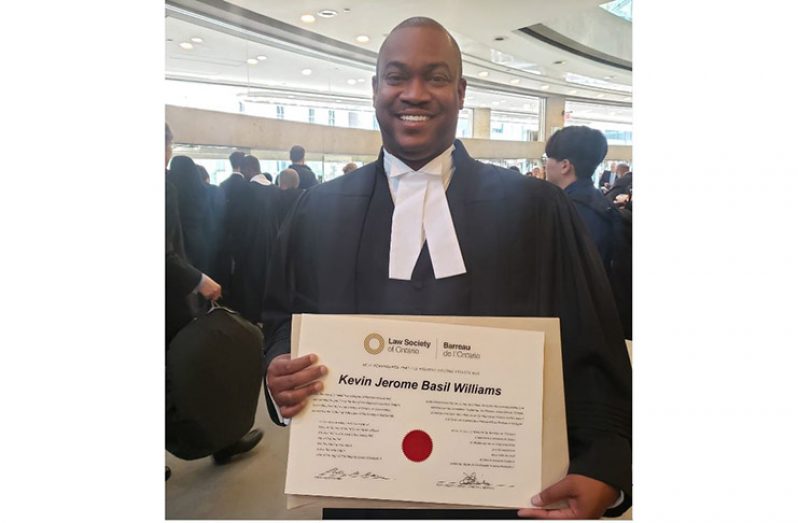 Attorney-at-law, Kevin Williams displays his certificate