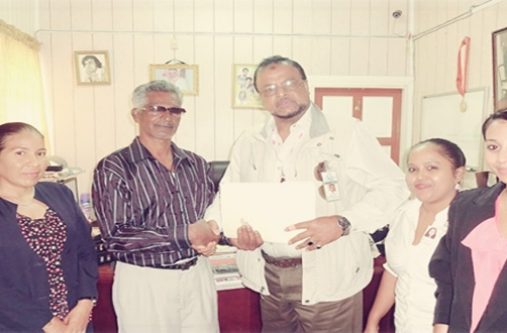 The RK Family. From left are: Ms. Annmarie Mohammed, Mr. Roshan Khan (Centre), Ms. Annie Nauth, and Ms. Kimberly Lutchman.  Talented Guyanese writer Bobby Kissoon is seen with them