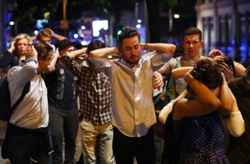 People leave the area with their hands up after an incident near London Bridge in London, Britain June 4, 2017 (REUTERS/Neil Hall)