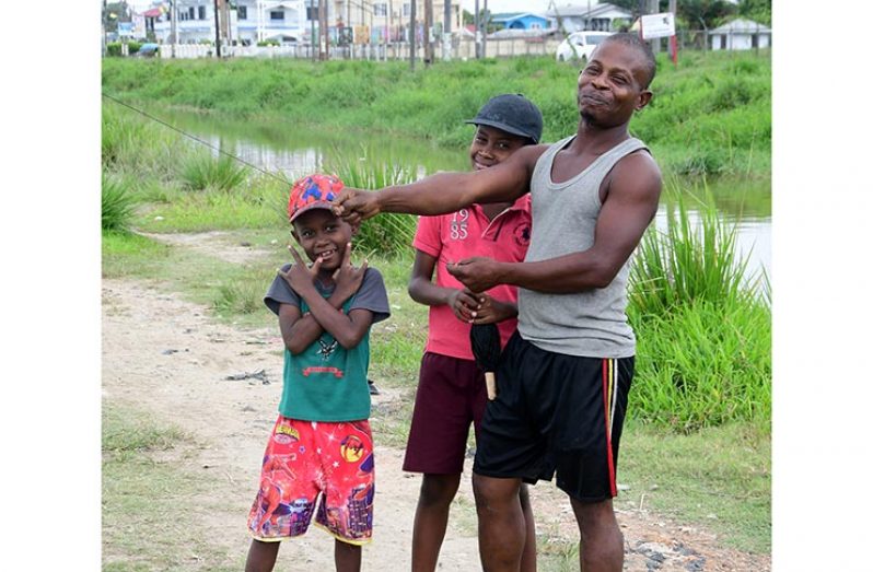 Despite restrictions, Richard Harris still took his daughter Athea out for a few minutes to enjoy some kite- flying (Adrian Narine photo)