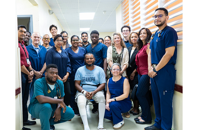 Haemophilia ‘A’ patient Pooran Sookdeo and members of the medical team who participated in a complex surgical procedure, which has made it possible for him to walk again