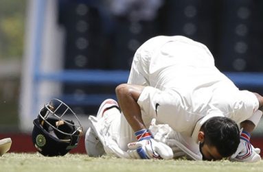 Virat Kohli kisses the pitch after reaching his double hundred in Antigua, yesterday.