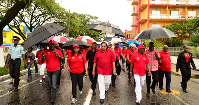Prime Minister Moses Nagamootoo and Minister of Social Protection Volda Lawrence stride towards the National Park   (Photos by Adrian Narine and Samuel Maughn )