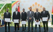 President, Dr. Irfaan Ali (third from left) poses with the newly sworn-in land surveyors. (From left) Terron Roberts, Marc Nicholson, Royston Washington, President Ali, Elijah Persaud, and Tedwin Roache (Delano Williams photo)