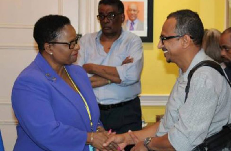 Minister of Public Health, Volda Lawrence greets a Guyanese doctor from the diaspora, Dr. Navendra Persaud at an engagement at the Guyana Embassy in Washington DC.