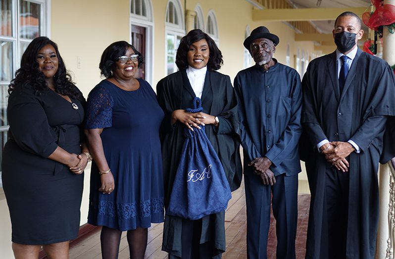 New Attorney at Law Frances Carryl (centre) with lawyer Ronald Burch-Smith (right) and her family members. From left: Frances’s sister, Tamicola; her mom, Lavern and her dad Francis (Elvin Croker photo)