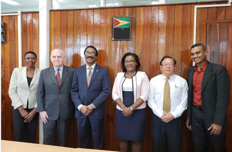 Attorney General Basil Williams and officials of his ministry pose with Consultant Mr. Peter Pursglove S.C, (second from left), who is contracted under the Support of Criminal Justice System Programme (SCJS) to review the existing legislation and propose recommendations for amendments to the Act.