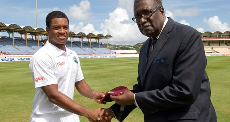 Leon Johnson receives his West Indies Test cap from  former captain Clive Lloyd before the start of play on the first day of the second Test against Bangladesh in St. Lucia, yesterday. (WICB photo)