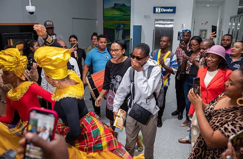 Best known for her role in Black Panther, Letitia Wright, a Guyanese-British actress, arrived in Guyana on Friday night and was met with an unexpected welcome ceremony at the Cheddi Jagan International Airport (CJIA). The star was greeted by the Minister of Tourism, Industry, and Commerce and performances by the National Dance School as well as drummers upon returning to her homeland after 21 years (Delano Williams photos)