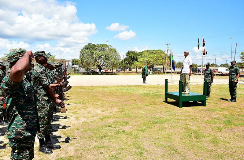 President David Granger receiving the Presidential salute from ranks of the Guyana Defence Force upon his arrival at Base Camp Kanuku in Lethem