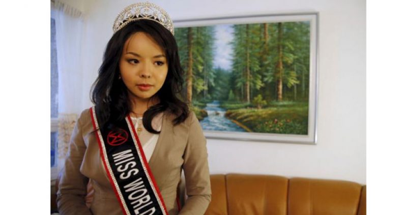 Miss World Canada Anastasia Lin poses with her crown before an interview at her home in Toronto, Ontario November 10, 2015.
Reuters/Chris Helgren