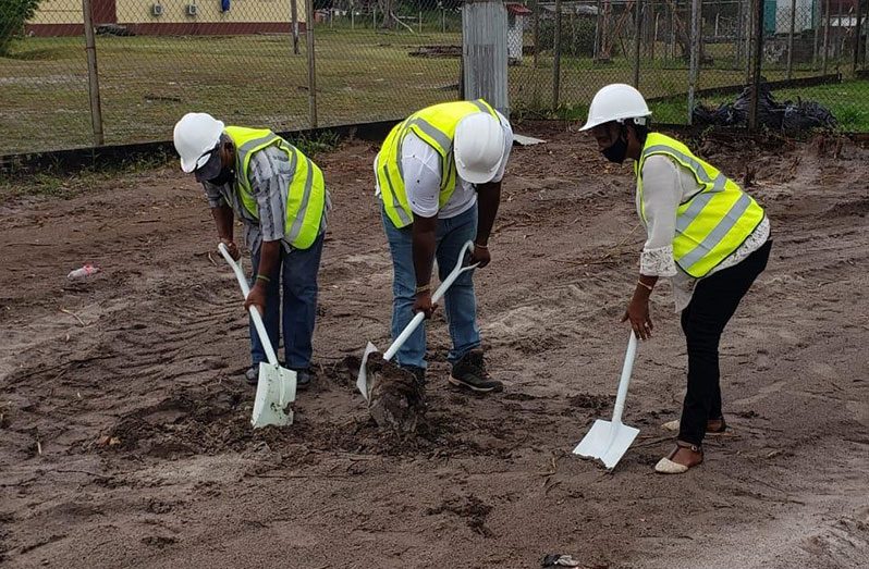 Officials from the RDC of Region 10 turn the sod for the construction the new Blueberry Hill Health Centre (RDC photo)