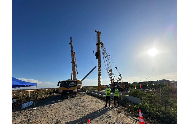 Pile driving has begun along the Railway Embankment, East Coast Demerara, to install new 69 kv transmission lines (Office of the President photos)