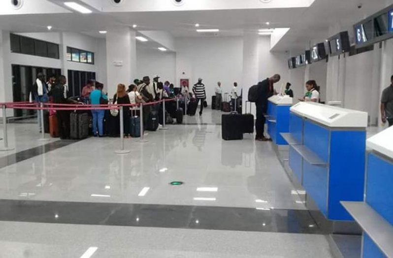 CAL passengers checking in at the CJIA (Minister Annette Ferguson photo)