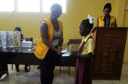 First Place winner of the Essay Competition on the topic: “What is Linden like after 100 years of bauxite mining?”Shaqueena Edwards of Amelia's Ward primary receives her prize.