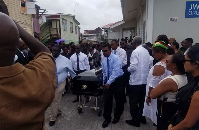 Colleagues and relatives bear the body of Captain Randy Joseph Liverpool following his funeral service at the Wortmanville Congregational of Jehovah’s Witnesses, Norton Street, on Saturday