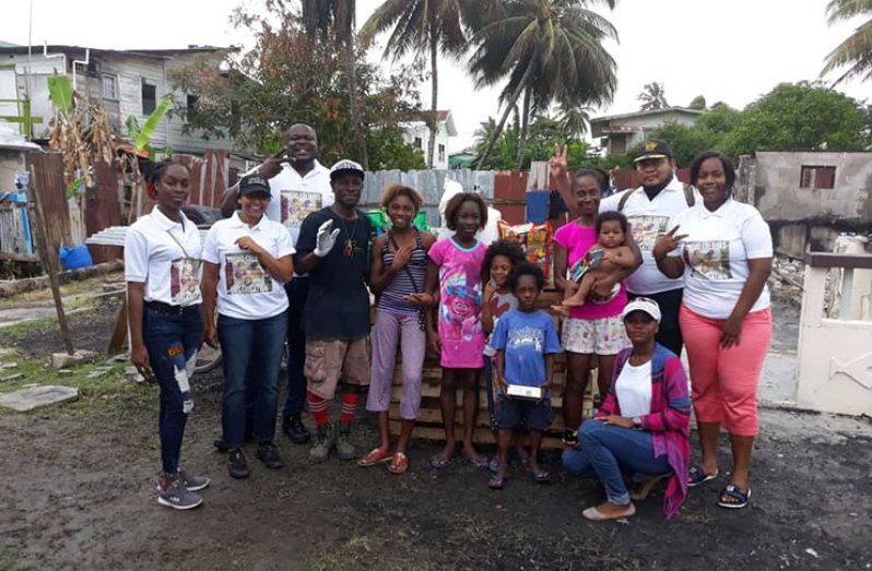 Members of The Living Colour donating hampers to the fire victims of Plaisance