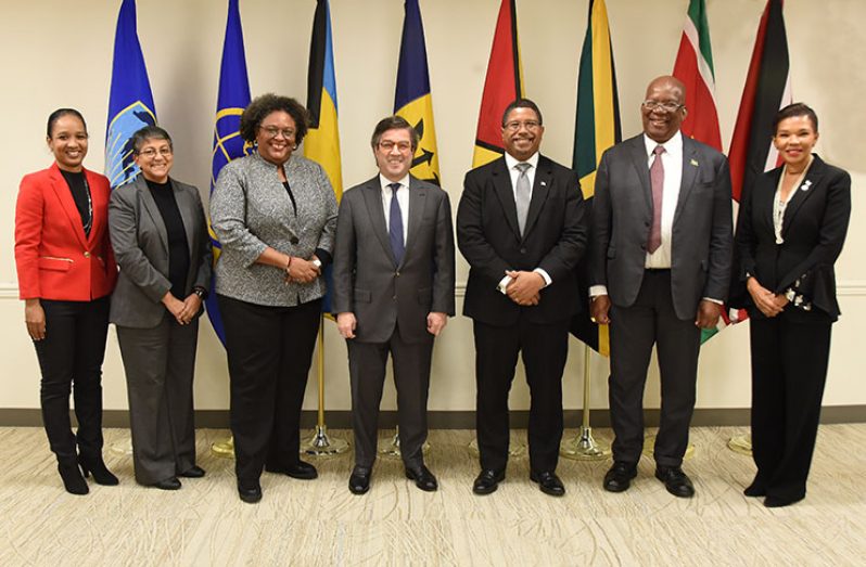 Finance Minister, Winston Jordan (second from right) poses with IDB President, Mr. Luis Alberto Moreno (centre) and Barbados Prime Minister, Mia Mottley along with other officials during the signing ceremony