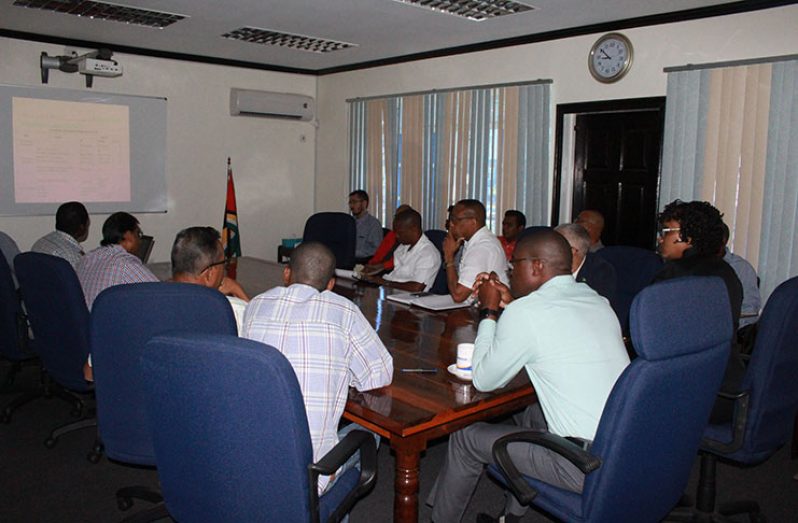 Minister of Public Infrastructure, David Patterson; Minister within the Ministry, Annette Ferguson and other officials meeting with local suppliers