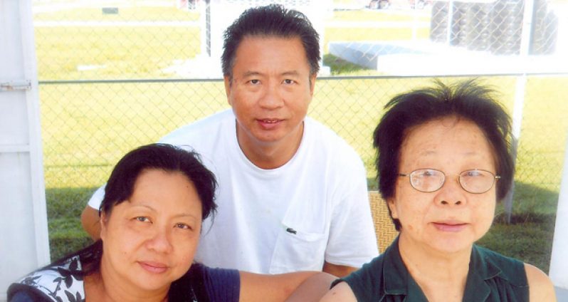 With his mom Eunice and sister Joy.