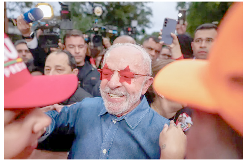 Brazilian President Luiz Inacio ‘Lula’ da Silva greets supporters in Sao Paulo, Brazil, on October 25 (Tuane Fernandes/Reuters)