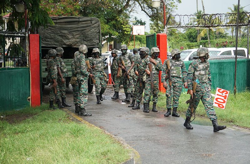Several army units were deployed to assist in containing the situation at the Lusignan Prison, following a fire at the penitentiary on Sunday afternoon (Elvin Croker photo)