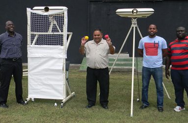 GCB’s Colin Stuart and Drubahadur with the newly acquired bowling machines.