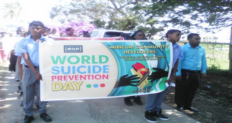 Students displaying the banner of the Mibicuri Community Developers