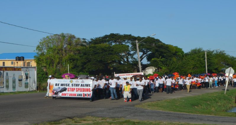 The hundreds who joined the road safety march from the Kitty Seawall to the Guyana Police Force Seawall Band Stand, Kingston, yesterday (Cullen Bess-Nelson photo)