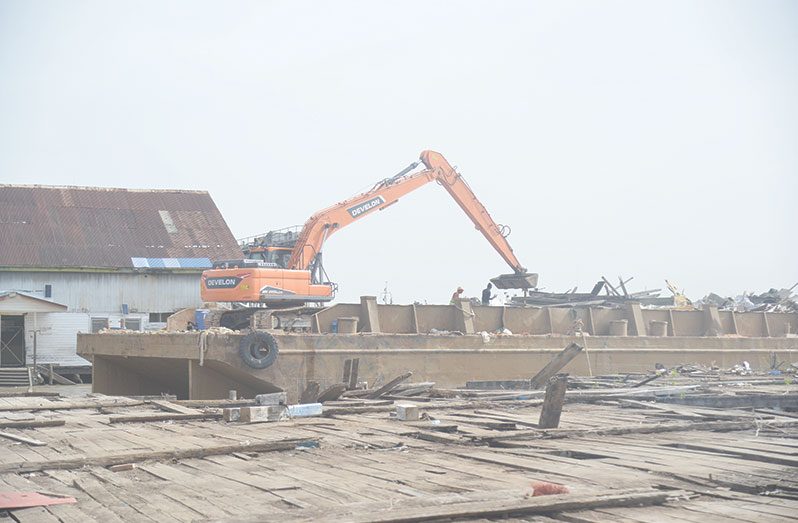 On Sunday, the Guyana Chronicle captured scenes of the ongoing efforts to clear debris, following Wednesday’s incident at the Stabroek Market where a portion of the roof covering the wharf collapsed, injuring several persons (Japheth Savory photo)