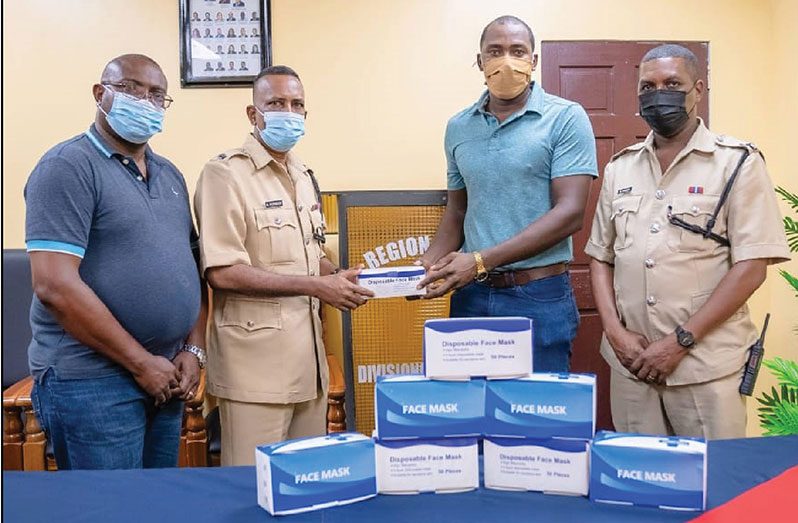 From left, Detective Assistant Superintendent Troy Whittaker, Deputy Commander Boodnarine Persaud, Ryan Hercules of Parika Salem, and Inspector Eon Isaacs at the Leonora Police Station yesterday.