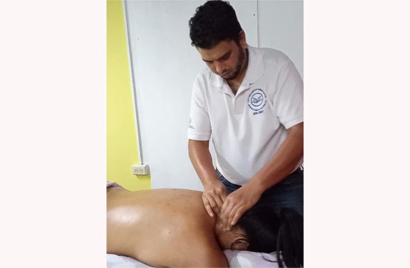 Massage therapist Rajendra Prabudial in action