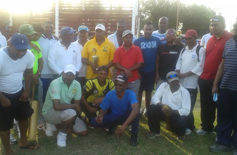 The winning Reliance Masters team pose with their trophies