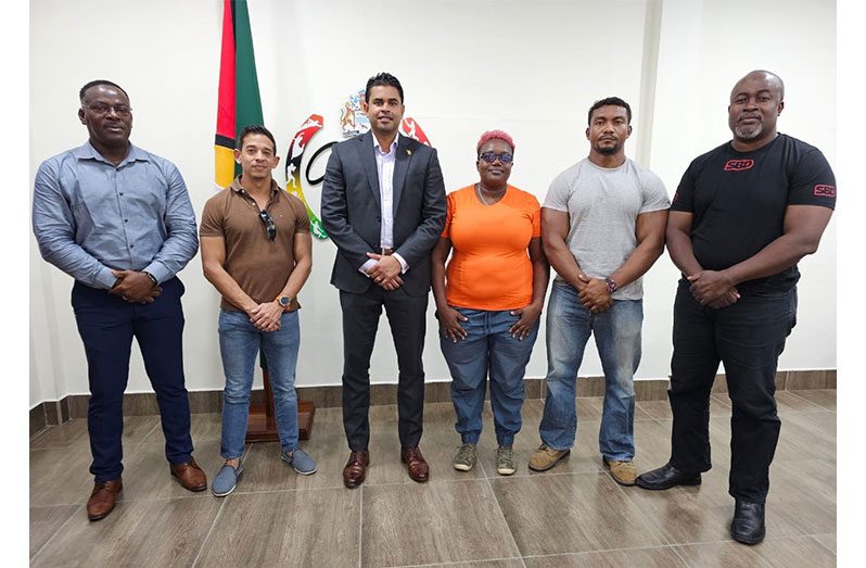 Minister Charles Ramson (3rd left) is flanked by, from right, Dexter Jones, Carlos Petterson-Grifith, Nicola Searles, Jamie McDonald, and Franklin Wilson.