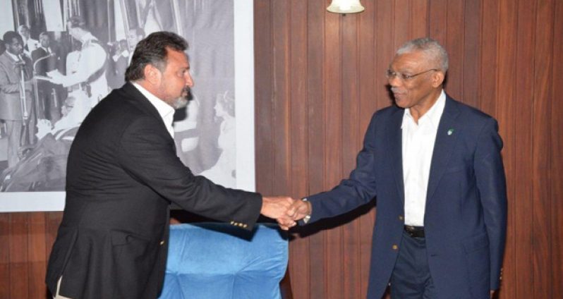 President David Granger shakes hands with Director of the Princess International Group, Mr Mehmet Hamdi Karagozoglu on Thursday at the Ministry of the Presidency