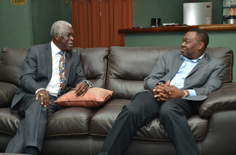Director General of the Guyana Civil Aviation Authority (GCAA) Retired Lieutenant Colonel, Egbert Field [left] and President of the International Civil Aviation Organisation (ICAO), Dr. Olumuyiwa Benard Aliu in discussion at the Roraima Lounge at CJIA
