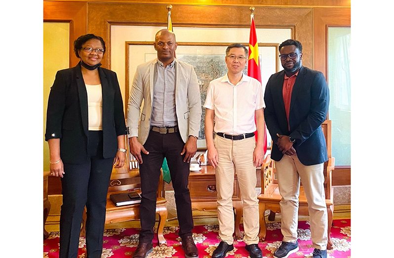 From left: Deidre Edghill, Godfrey Munroe, Mr. Chen Xilai and Mr. Ishaka Jackman