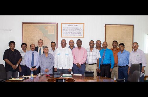 meeting Minister of Finance Winston Jordan, Junior Finance Minister, Jaipaul Sharma and Bank of Guyana Governor, Dr Gobind Ganga pose with representatives of Berbice Business Chambers