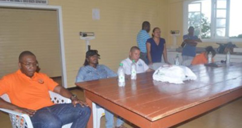 From left to right, Dr. Horace Cox, Director of Vector Control, Dr. Kay Shako – Director, Regional Health Services, and Dr. George Norton, Minister of Public Health. The Minister was meeting with staff of the Kumaka District Hospital, where the issue of water transportation to the region was raised