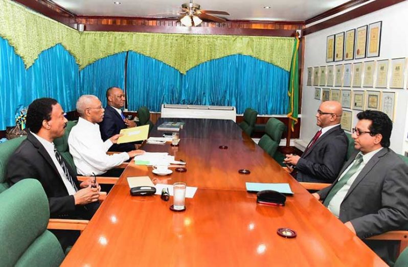 Attorney General, Mr. Basil Williams; President David Granger and Minister of State, Mr. Joseph Harmon, in discussions with Opposition Leader, Mr. Bharrat Jagdeo and PPP Member of Parliament, Mr. Anil Nandlall at State House