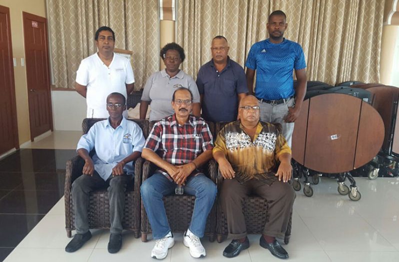 Dhierandranauth Somwaru (seated centre) is flanked by other executive members of the BCB. Missing is Winston Roberts. (Rajiv Bisnauth photo)