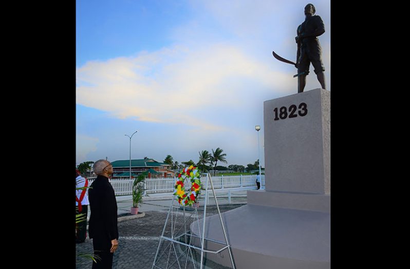 President David Granger places a wreath at the 1823 Demerara Revolt Monument at Atlantic Avenue (Ministry of the Presidency)