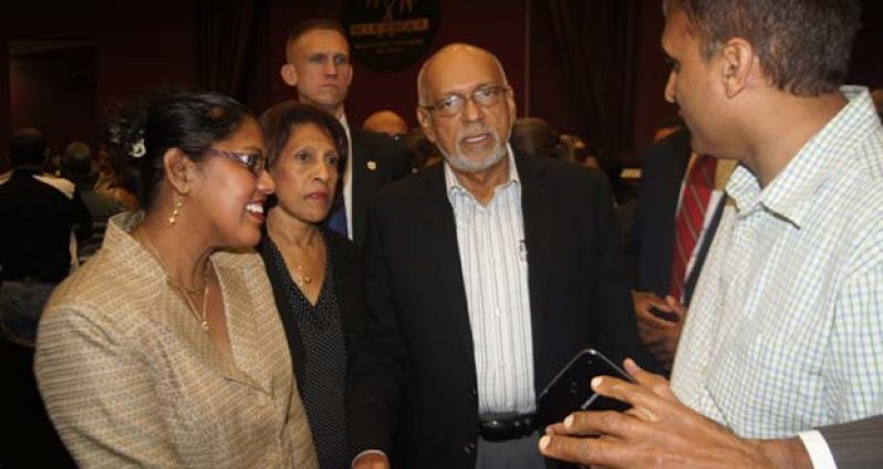 President Donald Ramotar and First Lady, Deolatchmee Ramotar listening to a member of the Guyanese diaspora in Miami