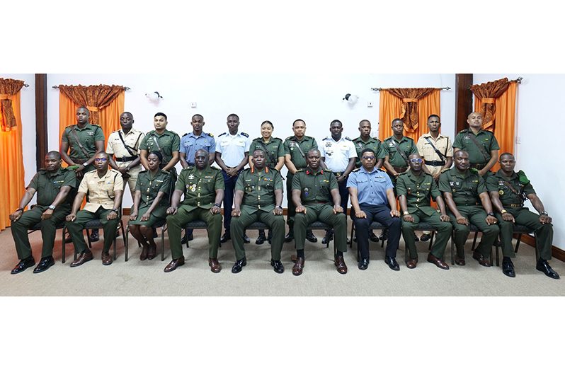 Chief-of-Staff, Brigadier Godfrey Bess (centre seated), flanked by other senior officers and the junior officers (standing) who completed the Junior Command and Staff Course 30 (JCSC 30)