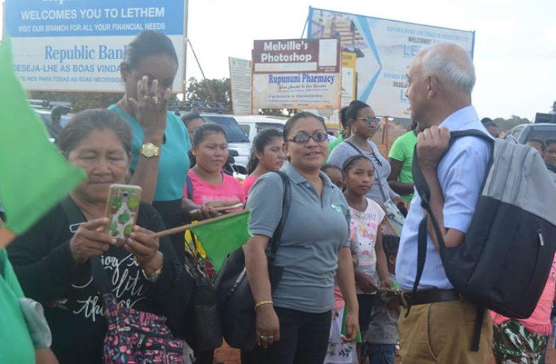 Minister of Communities, Ronald Bulkan, interacting with residents on his arrival at Lethem