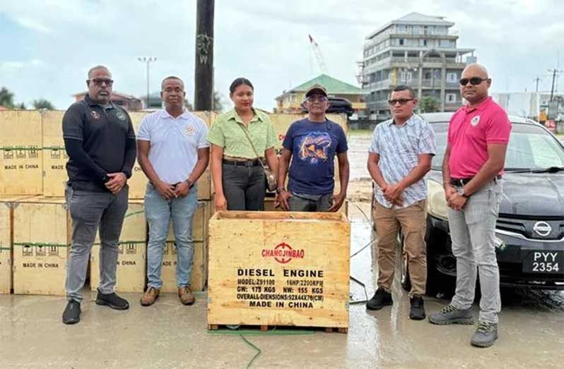The delegation flanked by two small-scale miners