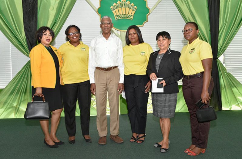 President David Granger with members of the Guyana Women Miners’ Association at the business luncheon